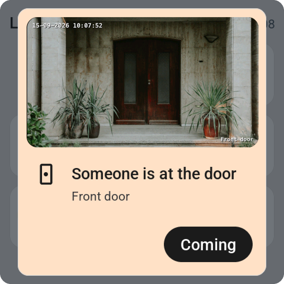 An alert on the Guition with the front door camera's picture across the top: someone is at the door, with a Coming button
